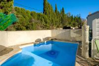a large blue swimming pool in a backyard at Villa Provence Vue Panoramique - in Fayence