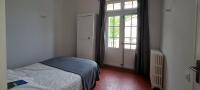 a small bedroom with a bed and a window at Gîte Marronnier in Tourrettes-sur-Loup