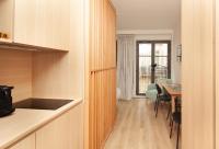 a kitchen with a table and a dining room at FINESTATE Coliving Champs-Elysées in Paris