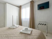 Posteľ alebo postele v izbe v ubytovaní Azzurra Apartments