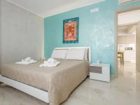 Posteľ alebo postele v izbe v ubytovaní Azzurra Apartments