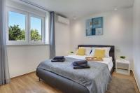 Posteľ alebo postele v izbe v ubytovaní Villa mit privatem Pool, Klima, WLAN, BBQ in der Nähe vom Meer