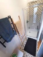a small bathroom with a shower and a towel at Standing, calm &amp; confort. in Bègles