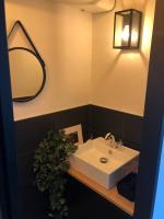 a bathroom with a white sink and a mirror at Standing, calm &amp; confort. in Bègles