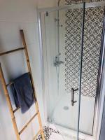 a shower with a glass door in a bathroom at Standing, calm &amp; confort. in Bègles