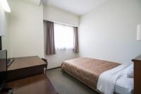 南福岡グリーンホテル-Minami Fukuoka Green Hotelにあるベッド