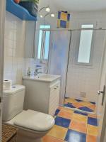 a bathroom with a toilet and a sink and a shower at studio à 200 M de la plage in Valras-Plage