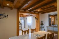a kitchen and dining room with a table and chairs at VENEZ SEJOURNER A GRUISSAN ....PLAGE DES CHALETS in Gruissan
