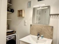 a bathroom with a sink and a mirror at Les bords du Clain - Entrée Autonome Studio in Poitiers