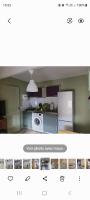 a kitchen with a refrigerator and a microwave at studio 27m2 in Quissac