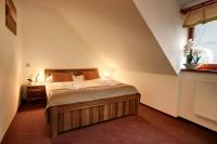 Łóżko lub łóżka w pokoju w obiekcie Golf&Wellness Resort Alfrédov