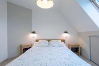 Cama o camas de una habitaci&oacute;n en Appartement 100m2 Vilvic vue mer