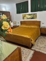A bed or beds in a room at VILLA ISELLA