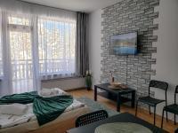 Postel nebo postele na pokoji v ubytování Studios and Apartments - Semiramida Gardens