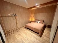 a bedroom with a large bed in a room at HAVRE DE PAIX LES PIEDS DANS L&#39;EAU in Istres