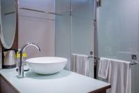 a bathroom with a white bowl sink on a counter at CHECK inn Taipei Xinyi in Taipei