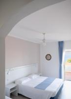 Posteľ alebo postele v izbe v ubytovaní Hotel Paradiso