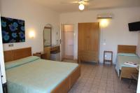 Posteľ alebo postele v izbe v ubytovaní Hotel Paradiso