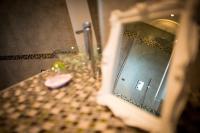 a bathroom with a sink and a mirror at Lyolyl BnB in Sainte-Croix-sur-Orne