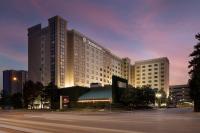 a hotel building with a parking lot in front of it at DoubleTree by Hilton Chicago O'Hare Airport-Rosemont in Rosemont
