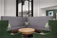a living room with a couch and chairs at DoubleTree by Hilton Chicago O'Hare Airport-Rosemont in Rosemont