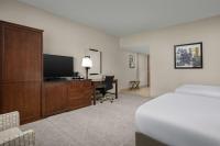 a hotel room with a bed and a desk and a television at DoubleTree by Hilton Chicago O'Hare Airport-Rosemont in Rosemont