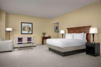 a hotel room with a bed and a chair at DoubleTree by Hilton Chicago O'Hare Airport-Rosemont in Rosemont