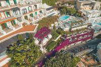 an aerial view of a resort with a pool and buildings at Hotel Poseidon in Positano