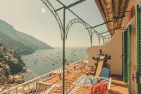 a balcony with a view of a body of water at Hotel Poseidon in Positano
