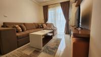 TV a/nebo společenská místnost v ubytování Modern apartment with private garden Madinaty