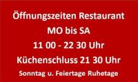een rood bord met witte letters erop bij Hotel Restaurant Schwartz in Neusiedl am Steinfelde