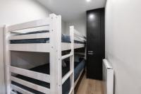 a bunk bed room with two bunk beds at Appartement 2 chambres avec balcon et parking in Val Thorens