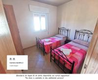 Posteľ alebo postele v izbe v ubytovaní Villa Sole - Villa Vacanze Indipendente & Climatizzata - Salento - Puglia - ITALY