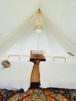 a room with two beds in a tent at The Silence Manor in Ruisui