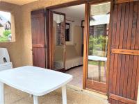 a room with a white table and a sliding glass door at Appartement Le Monêtier-les-Bains, 2 pièces, 4 personnes - FR-1-330F-225 in Le Reposoir