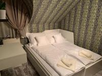 Posteľ alebo postele v izbe v ubytovaní Ede Apartman