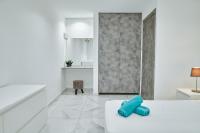 Postel nebo postele na pokoji v ubytování Nissi Avenue Suites