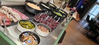 a buffet with many different types of food on a table at Hotel L&#39;Abri in Le Puy-en-Velay
