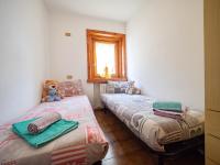 Posteľ alebo postele v izbe v ubytovaní Appartamento Mokino Center Myholidaylivigno