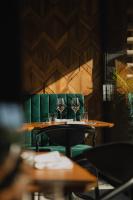 ein paar Tische mit Weingläsern drauf in der Unterkunft AS Boutique Hotel, superior in Ljubljana