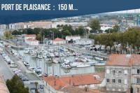 a group of boats docked in a marina at COZY - Appartement de charme proche thermes in Rochefort