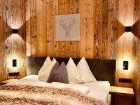 Posteľ alebo postele v izbe v ubytovaní Sonn-Alm Chalet-Apartments
