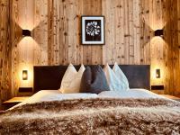 Posteľ alebo postele v izbe v ubytovaní Sonn-Alm Chalet-Apartments