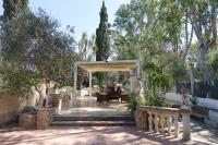 A garden outside Giardini Sausari Residence