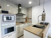 Kuchyň nebo kuchyňský kout v ubytování Macarelleta Apartamento con piscina