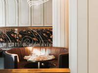 a dining room with a table with glasses on it at The Playford Adelaide - MGallery in Adelaide