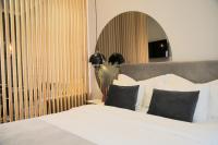Łóżko lub łóżka w pokoju w obiekcie MINT Boutique Studio Apartments