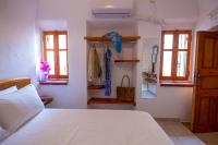 Postel nebo postele na pokoji v ubytování Bougainville House