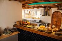 a kitchen with a counter with food on it at MAKTUB SURF HOUSE in Tamraght Ouzdar