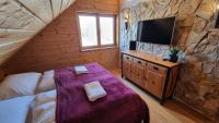 Postel nebo postele na pokoji v ubytování Penzion Srub Panorama